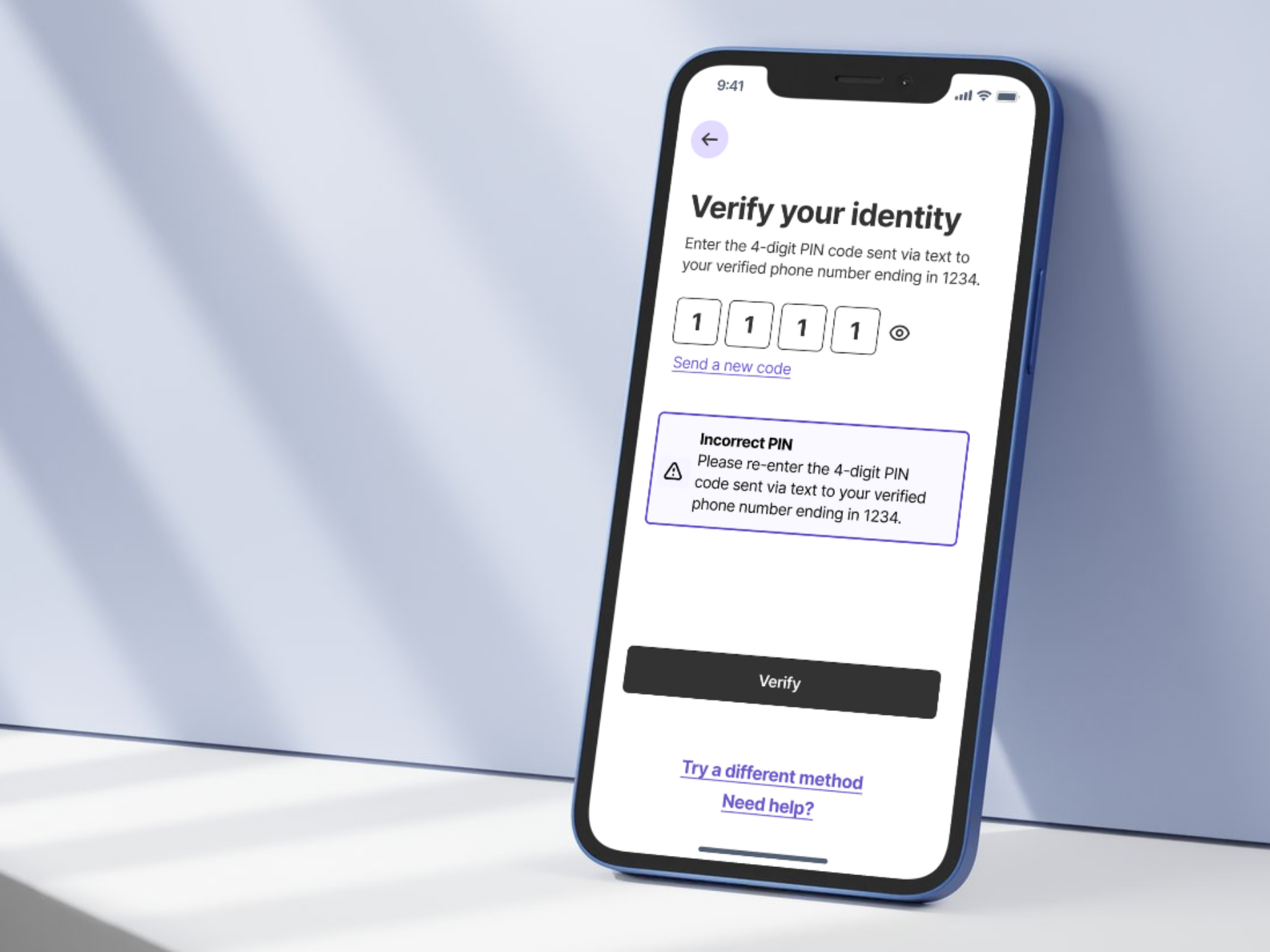 Mockup of authentication screen on an iPhone leaning against a wall